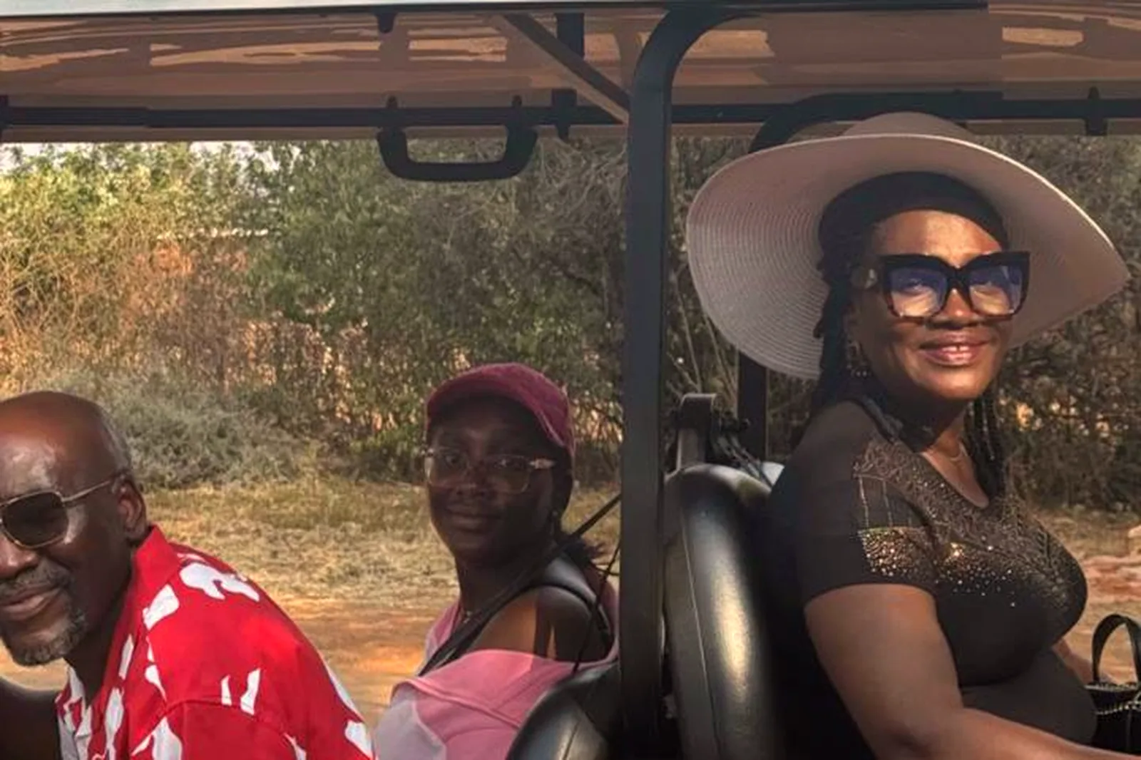 Family on an open game drive vehicle during a safari